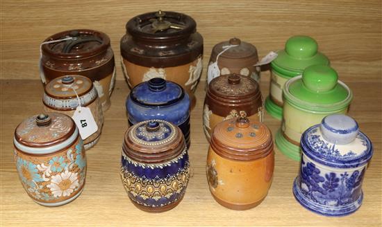 Twelve Doulton tobacco jars and covers, various designs